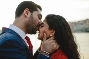 man kissing his lover on the nose gently after wedding proposal
